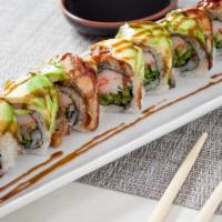 Dragon Roll · Eel and avocado, wrapped around kani, cucumber and kaiware.