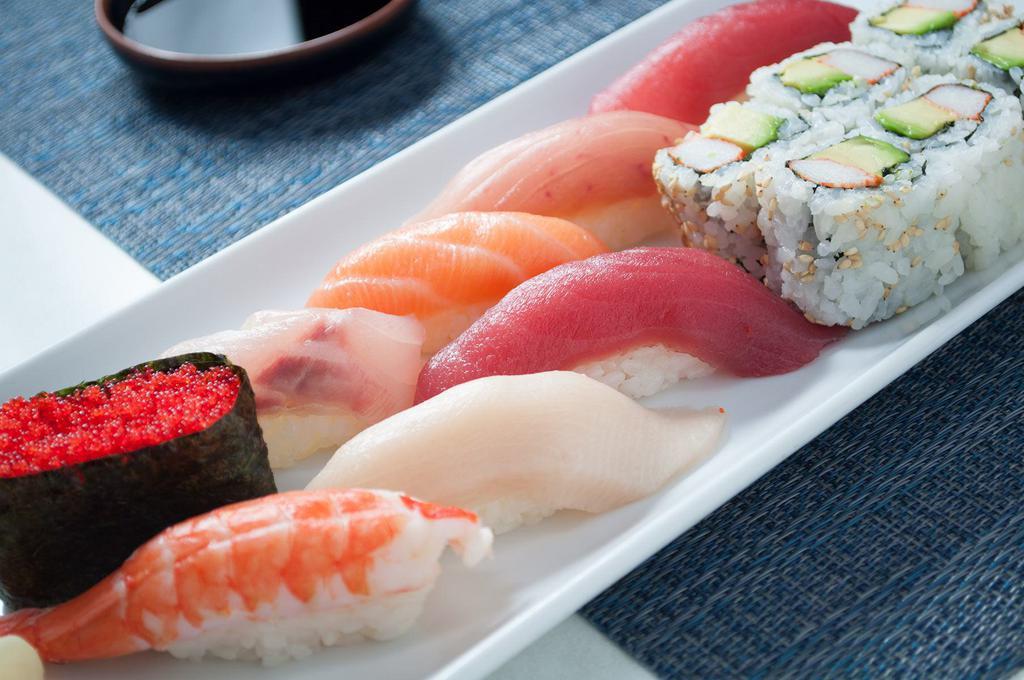 Sushi · 2 tuna, whitefish, salmon, yellowtail, albacore tuna, shrimp, tobiko and choice of a roll. Served with choice of a side.