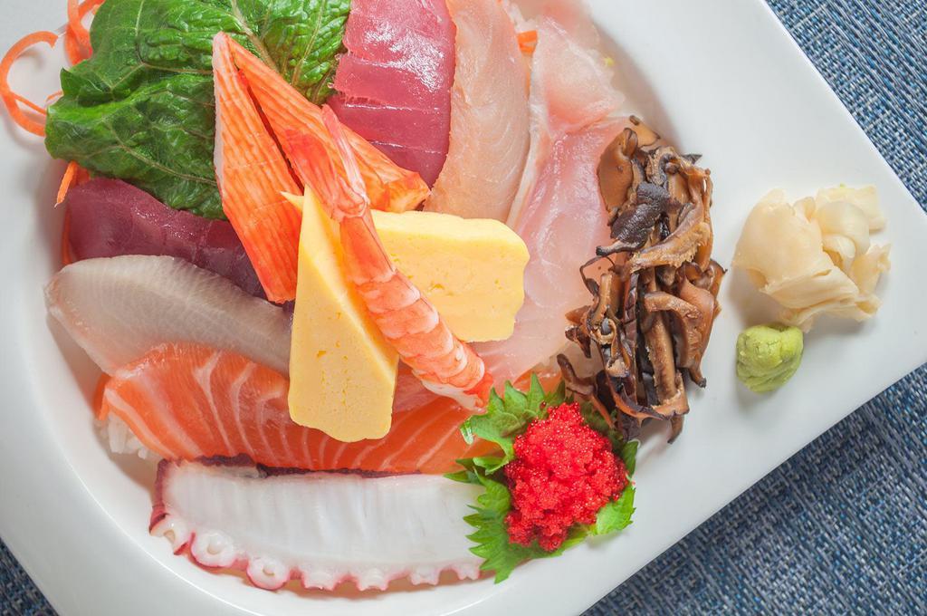Chirashi Sushi · 2 tuna, whitefish, salmon, albacore tuna, yellowtail, shrimp, 2 kani, octopus, tobiko and 2 tamago sashimi, on a bed of sushi rice. Served with choice of a side.