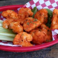 Cauliflower Wings · Gluten-free cauliflower bites battered and fried to a perfectly golden crisp, tossed in spic...