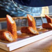 Kani Cheese · 6 pieces. Kanikama (crab sticks) stuffed with cream cheese, breaded and served with ranch sp...
