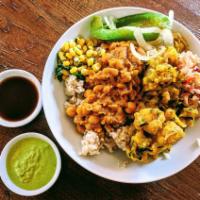 Vegan Favorite · Chola (Chick Peas), Punjabi Dal (Lentils), and Gobi (Cauliflower) served over Basmati rice.