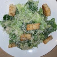 Caesar Salad · Lettuce, Parmigiano Reggiano and house-made croutons with house-made Caesar dressing.