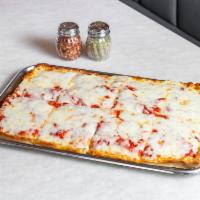 Classic Sicilian Pie · Thick squared crust with tomato sauce topped off with mozzarella cheese.