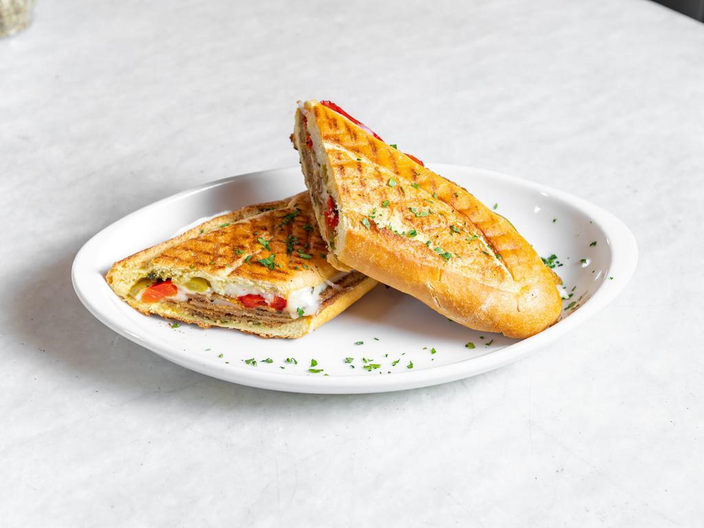 Grilled Chicken Panini · Served with pesto, roasted peppers and mozzarella.