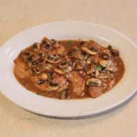 Veal Marsala · Medallions of veal sauteed in marsala wine with fresh mushrooms in a light brown sauce.