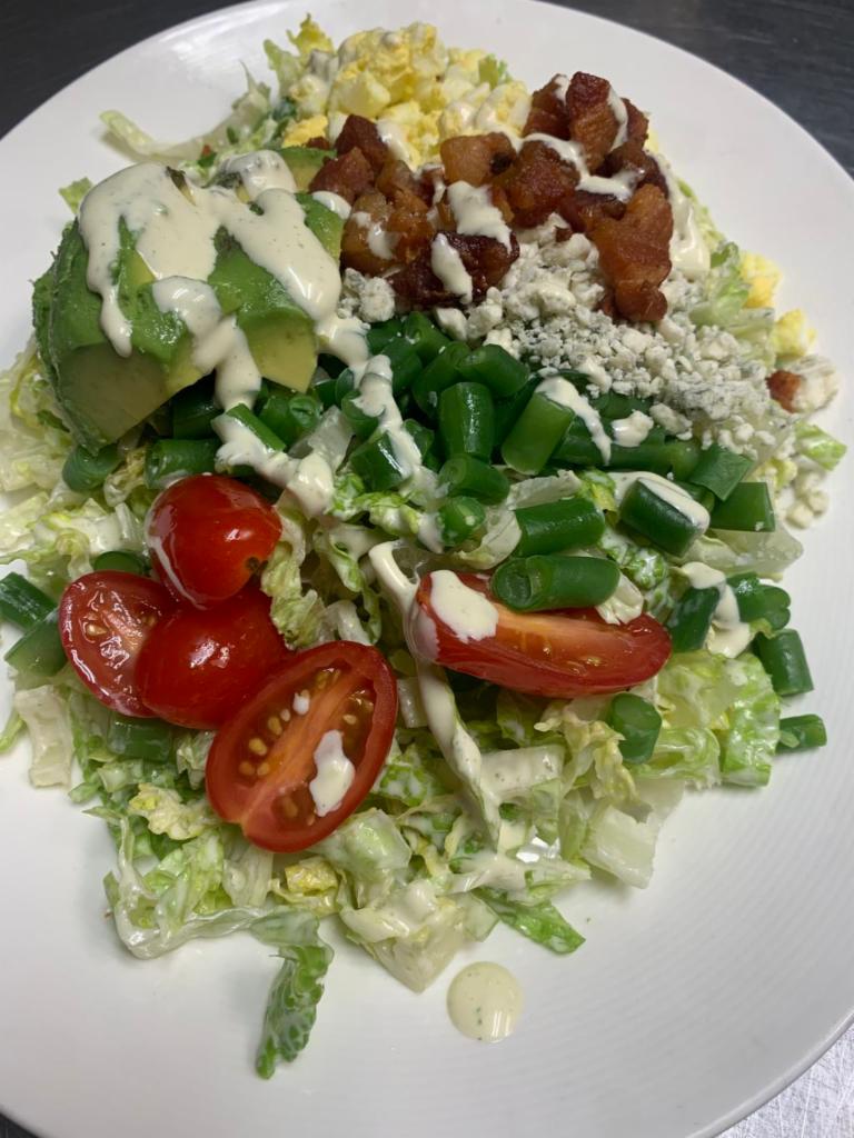 MB Cobb Salad · Romaine, avocado, tomatoes, egg, blue cheese, green beans, applewood smoked bacon, ranch dressing. Gluten-free.