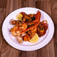 Guiso La Marina · Calamari, clams, crab, octopus, scallops, shrimp, tilapia sautéed in spicy marina sauce, ser...