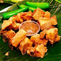 Lechon Kawali · Golden brown and crispy pork belly cut into cubes. Deep fried and tossed in seasoning.