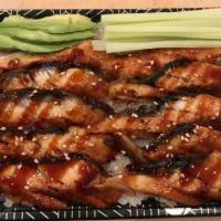 M6. Eel Unagi Don · Grilled eel on top of a bed of sushi rice, sesame and drizzled with eel sauce.