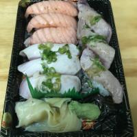 Torch Sushi: 3 Salmon, 3 Tuna, 3 Yellowtail · With ponzu sauce