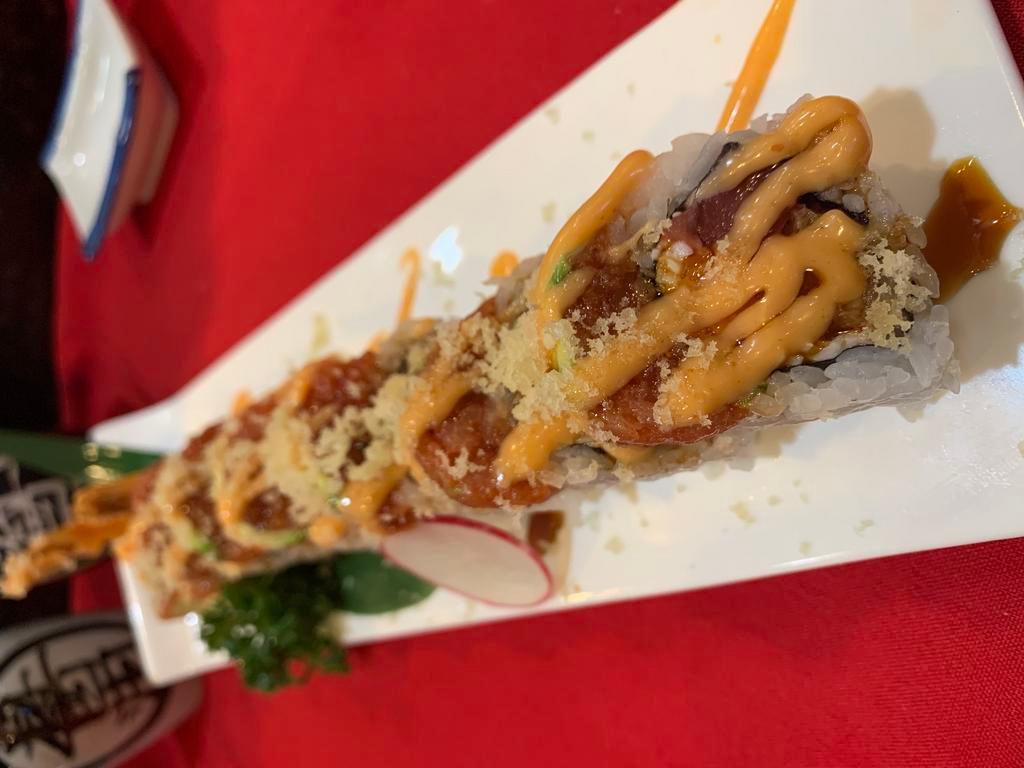 URI House Roll · Crab meat, tempura shrimp, tuna with spicy tuna and avocado and tempura flakes.