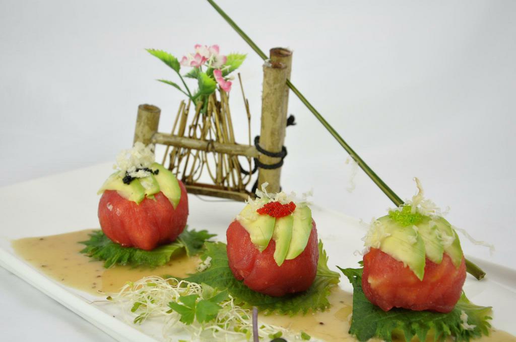 Tuna Dumpling (new) · Three pieces . lobster salad inside ,wrapped with fresh tuna and avocado on top. w/ chef special sauce