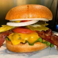 Undercover Cheeseburger · Beef patty, hickory smoked bacon, cheddar cheese, lettuce, tomatoes, onions, pickles, mustar...