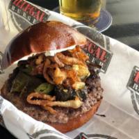 Illegal Cream Cheese · Beef patty, cream cheese, fried onion strings and fried jalapeños.