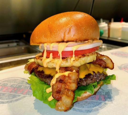 The Boss · Beef patty, grilled pineapple, fried jalapeños, cheddar cheese, hickory-smoked bacon, lettuce, tomatoes, onion, chipotle mayo.