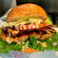 Chicken Club · Grilled chicken, hickory smoked bacon, avocado, lettuce, tomatoes, illegal sauce. 