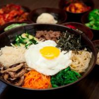 S10. Bibimbap · Rice with assorted vegetables and beef.