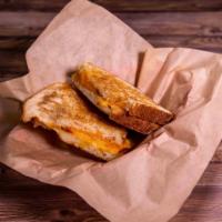 Rustic Grilled Cheese Sandwich · Smoked Gouda, Muenster, and yellow cheddar on rustic white bread. Gooey and simply delicious...