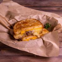 The Favorite Sandwich · American, cheddar, and Gruyère cheeses, crumbled bacon, and dijon mustard on Parmesan cruste...