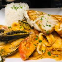 Seabass-Seafood a lo Macho · Pan seared fish of the day fillet mixed with seafood aji amarillo cream stew served with whi...