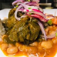 Seco de Carne · Cilantro beef short ribs. Beef short ribs cooked with cilantro rice sauce served with Peruvi...