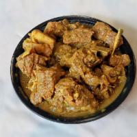 Large Curried Goat Combo Plate · Served with 3 sides and 1 meat.