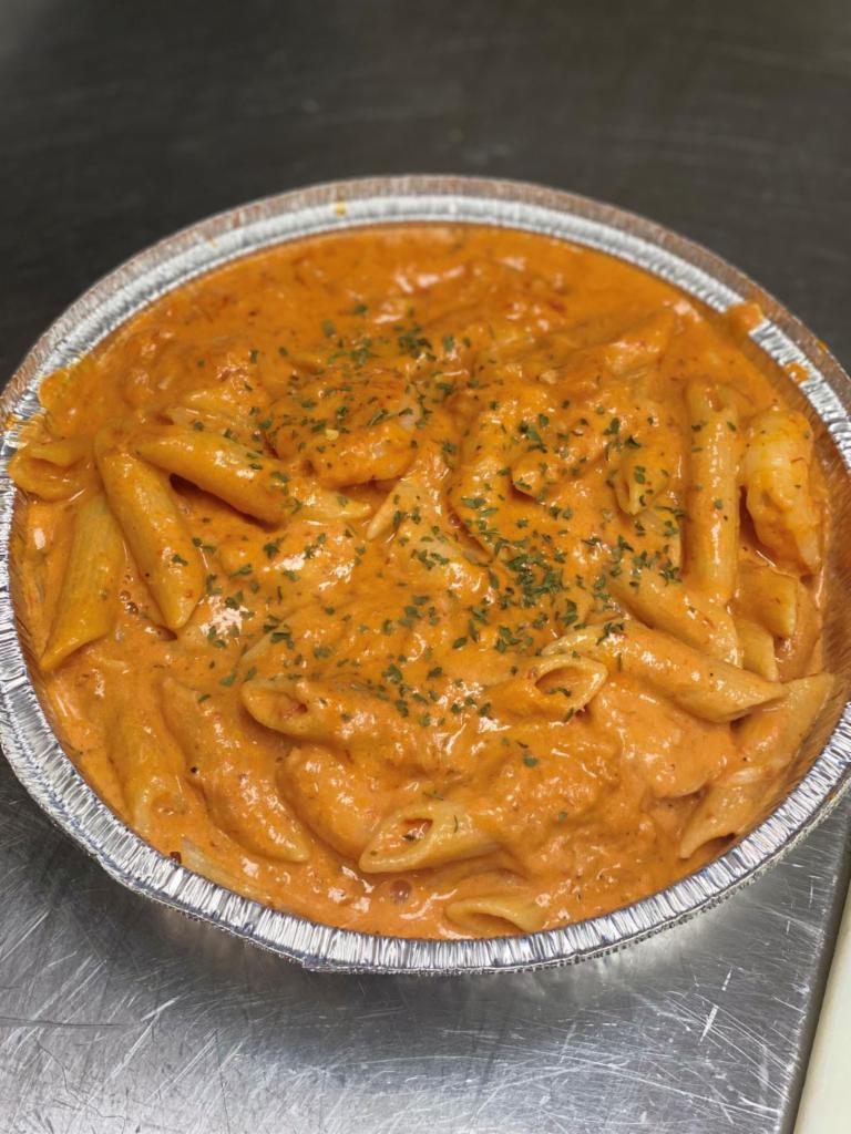 Crabby Friday · Real lump crabmeat and shrimp tossed with penne pasta in our signature tomato cream sauce. Served with salad and garlic bread.