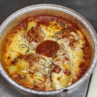Cheese Stuffed Shells · Jumbo pasta shells topped and baked with marinara sauce and mozzarella cheese. Served with S...