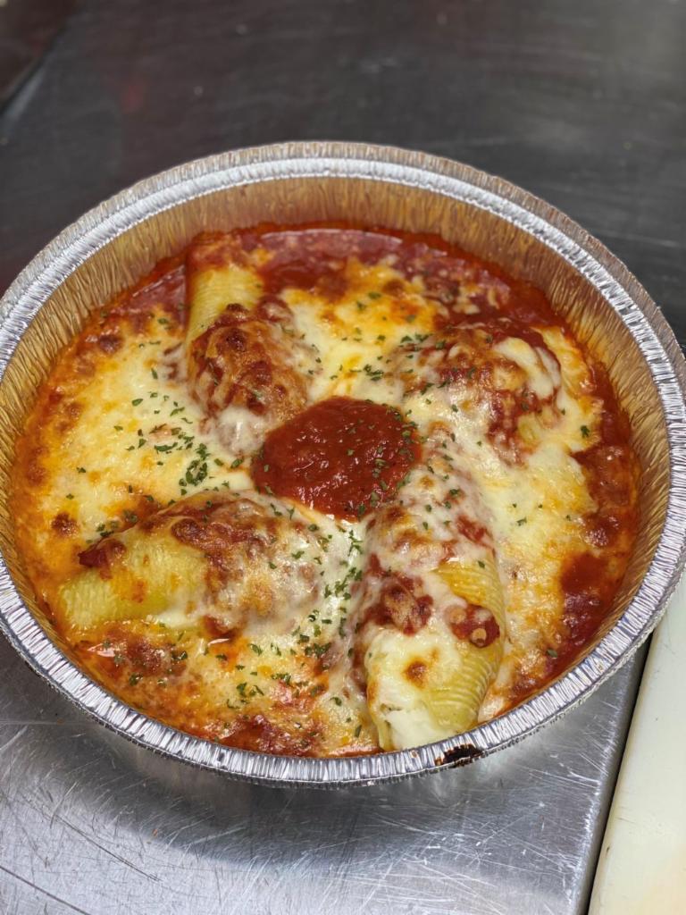 Cheese Stuffed Shells · Jumbo pasta shells topped and baked with marinara sauce and mozzarella cheese. Served with Salad & Bread.