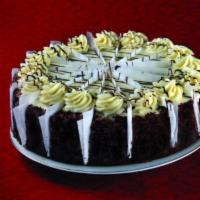 Red Velvet Cake · Three layers of dark red velvet cake is filled and iced with our rich cream cheese icing.  F...