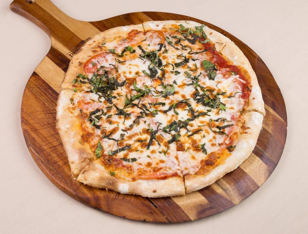 Margherita Pizza · Roma tomatoes, basil, fresh mozzarella, olive oil and fresh tomato sauce.