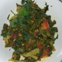 Bhindi Masala · Okra cooked with onion, ginger, garlic, tomatoes and Indian spices. Vegan.