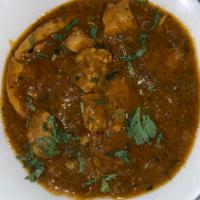 Chicken Curry · Boneless chicken cooked with onions,
tomatoes, fresh ginger, garlic and spices.
