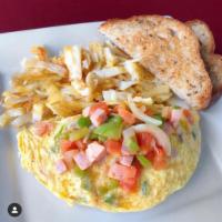 Denver Omelette · Ham, tomato, onions, green peppers served with seasoned hash browns and your choice of toast.