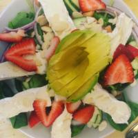 Strawberry Almond Brie Salad · Avocado, fresh strawberries, Brie, Roma tomato, cucumber and red onion on a bed of spinach w...