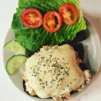 Albacore Tuna Melt Sandwich · Mozzarella melted over tuna salad with tomato and romaine on toasted pumpernickel.
