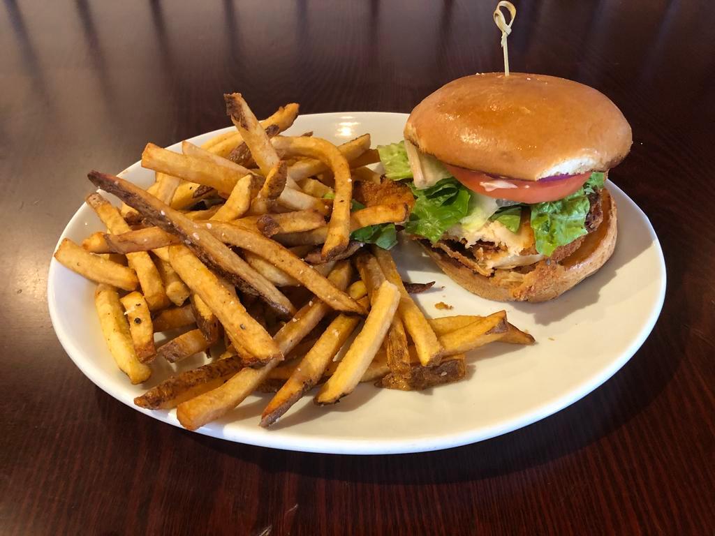 Chicken Sandwich · Delicious fried chicken breast topped with lettuce, tomato and onions and chipotle mayo. Served on a brioche bun with hand cut fries 