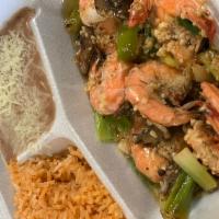 Camarones Al Mojo De Ajo · Fresh Pacific Prawns sauteed with Onion & Mushrooms in our Garlic Sauce. Served with Rice & ...