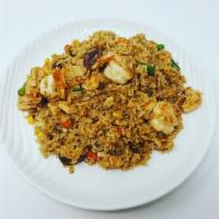 Combo Fried Rice · Steamed rice stir-fried in a wok with chicken, shrimp, beef, onions, peas, green beans, carr...