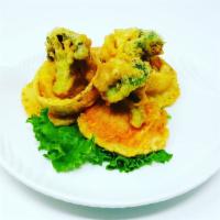 Vegetable Tempura · Lightly breaded, deep fried onion rings, broccoli, potato and sweet potato in a sweet tempur...
