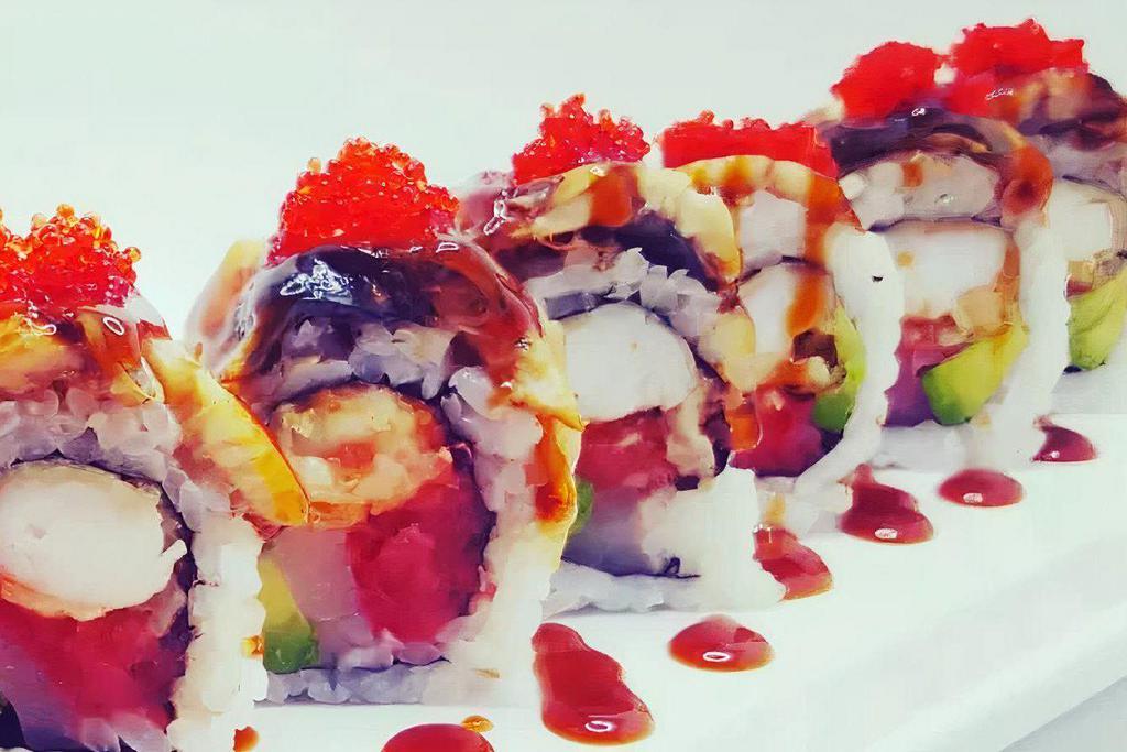 Konomi Roll · Seared scallop, spicy tuna, shrimp 
tempura, avocado topped with eel 
and tobiko with eel sauce
