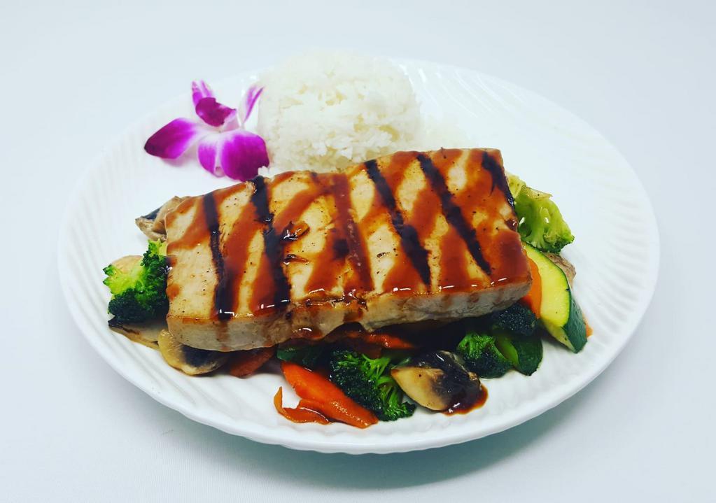 Tuna Teriyaki  · Fresh Hawaiian ahi tuna, seasoned with Japanese spice and grilled to perfection. Served with choice of side, steamed rice and grilled vegetables.