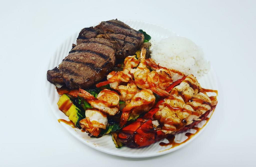 Sea Island Combination · 6 oz. lobster tail, Angus ribeye and grilled shrimp. Served with choice of side, steamed rice and grilled vegetables.