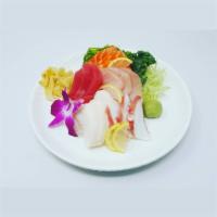 Chirashi · 15 pieces of fresh sashimi grade fish on top of sushi rice, seaweed salad and cucumber as a ...