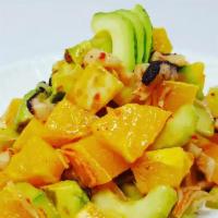 Hawaiian Madako Tako Salad · Fresh boiled octopus, avocado, orange, mango, green onion, cucumber and crab with Hawaiian d...