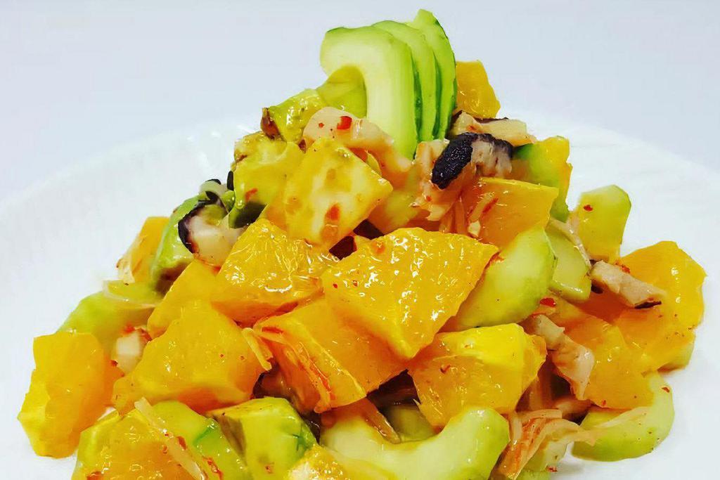 Hawaiian Madako Tako Salad · Fresh boiled octopus, avocado, orange, mango, green onion, cucumber and crab with Hawaiian dressing mix.