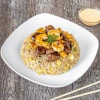Steak, Chicken and Shrimp Fried Rice · Hibachi Style:Your choice of Meat Marinated in our House Hibachi Sauce Served on top of Frie...