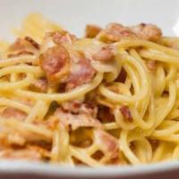 Spaghetti Carbonara  · Pancetta, onions and Parmesan in cream sauce.