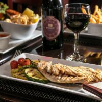 Pollo alla Griglia  · Grilled chicken breast served with grilled vegetables.